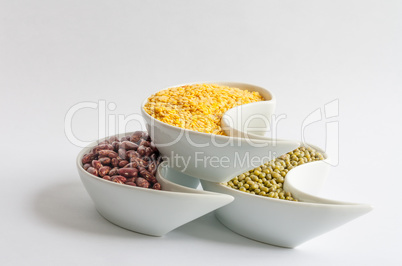 Multicolored beans in white ceramics bowl