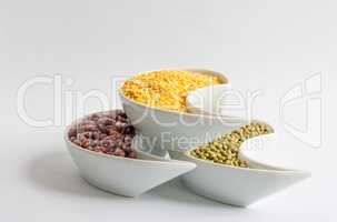 Multicolored beans in white ceramics bowl