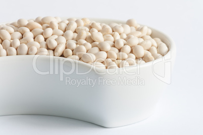 White beans in white ceramics bowl