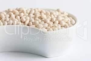 White beans in white ceramics bowl