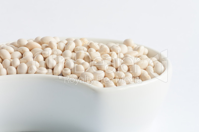 White beans in white ceramics bowl