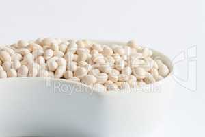 White beans in white ceramics bowl