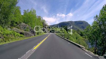 Driving a Car on a Road in Norway