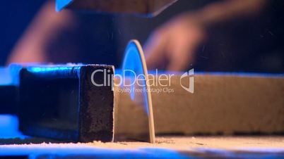 carpenter sawing a Board on the sawmill furniture