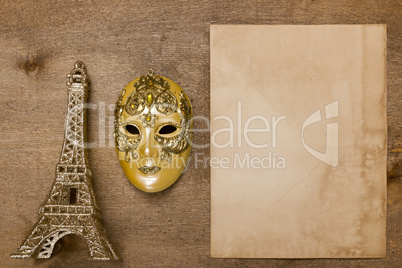 Gold theatrical mask and the Eiffel Tower