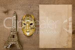 Gold theatrical mask and the Eiffel Tower