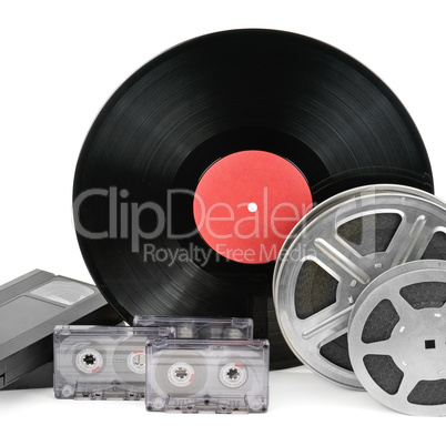 audio cassettes, records and film strip isolated on white backgr