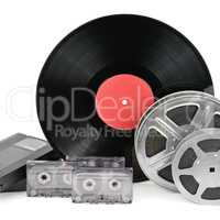 audio cassettes, records and film strip isolated on white backgr