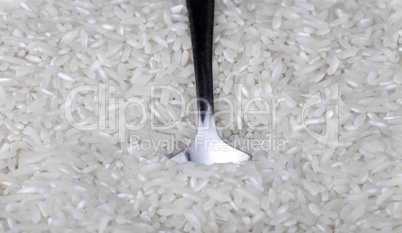 rice background and teaspoon