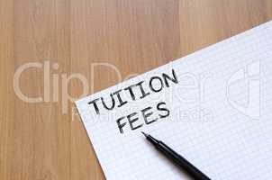 Tuition fees write on notebook