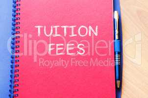 Tuition fees write on notebook