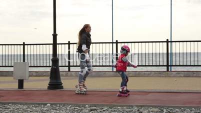 Mom and daughter learn to roller skate