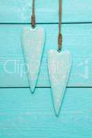 Two Hearts With Copy Space, Turquoise Wooden Background, Vertical Image