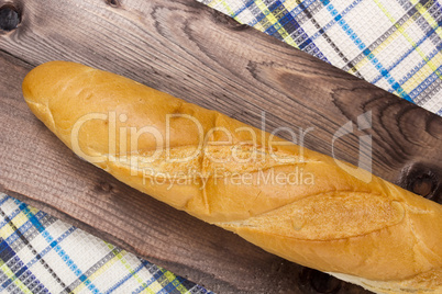 French baguette on a wooden background