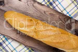 French baguette on a wooden background