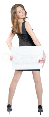 Business woman holding a large blank billboard and shows sign thumb-up