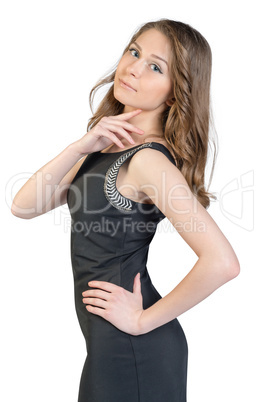 Young girl in a dress put her hand on neck and waist
