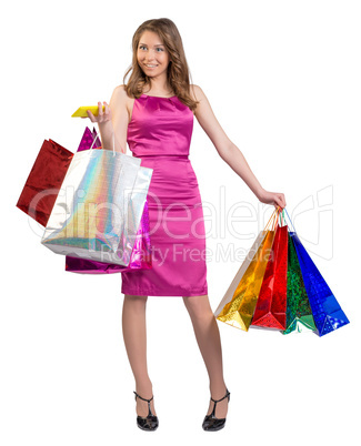 Young girl holding colorful bags and mobile phone in his hands