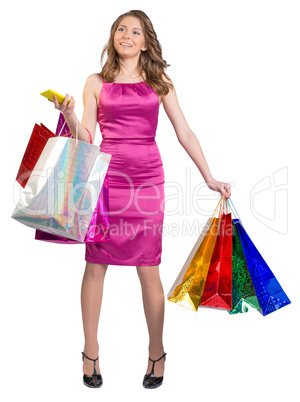 Young girl holding colorful bags and mobile phone in his hands