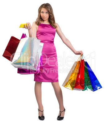 Young girl holding colorful bags and mobile phone in his hands