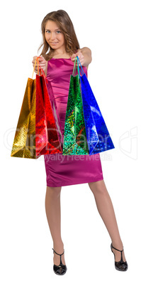 Shopping woman holding bags, isolated on white studio background