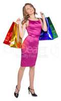 Shopping woman holding bags, isolated on white studio background