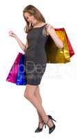 Shopping woman holding bags, isolated on white studio background