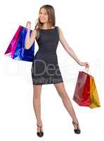 Shopping woman holding bags, isolated on white studio background