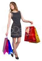 Shopping woman holding bags, isolated on white studio background