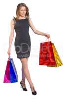 Shopping woman holding bags, isolated on white studio background