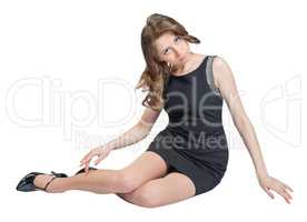 Glamorous caucasian woman lying on the floor studio isolated white background