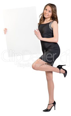 Woman is holding a big empty billboard, standing on one leg