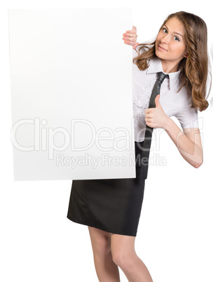 Woman looks out from behind a large blank white poster showing sign thumb-up