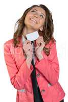 Joyful girl in suit holding blank sheet of paper and business card