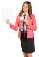 Young woman in suit holding blank sheet of paper and business card