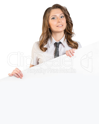 Woman in a tie holding large blank poster