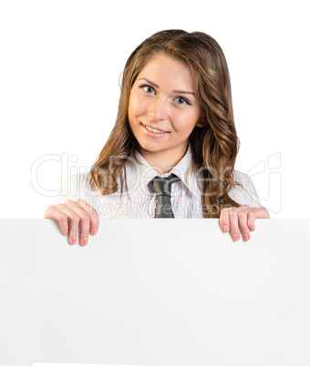Young girl in tie holding blank white sheet of paper
