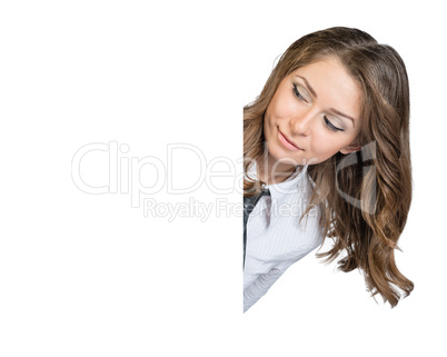 Girl looks out from behind a blank poster and looking at him