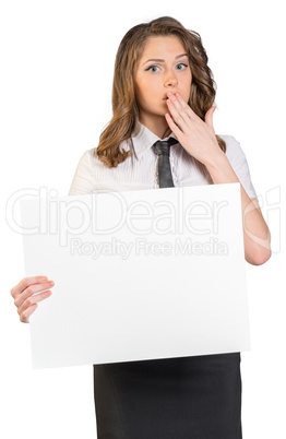 young girl put her hand over mouth and holding poster. On white background