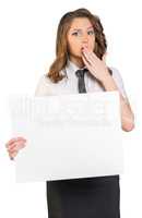 young girl put her hand over mouth and holding poster. On white background