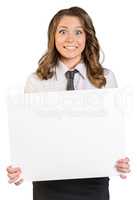 Joyful young girl holding a blank poster.