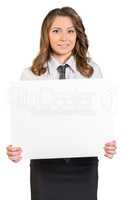 Young business woman holding blank poster.