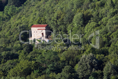 old stone church in forest