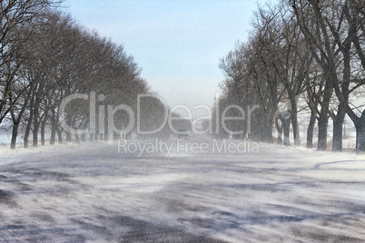 snowfall and blowing snow on winter road