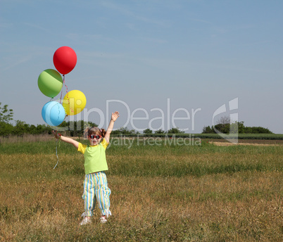 happy little girl with colorful balloons