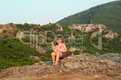 little girl holding tablet pc