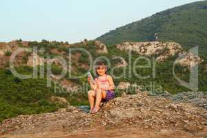 little girl holding tablet pc