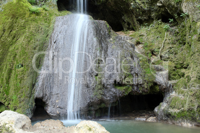 waterfall and cave nature scene