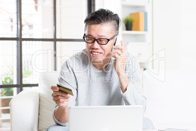 Mature man making order by phone