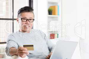 Asian man online shopping